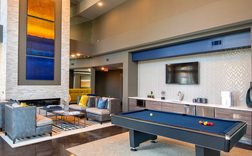 brightly lit resident lounge with kitchen and billiards room