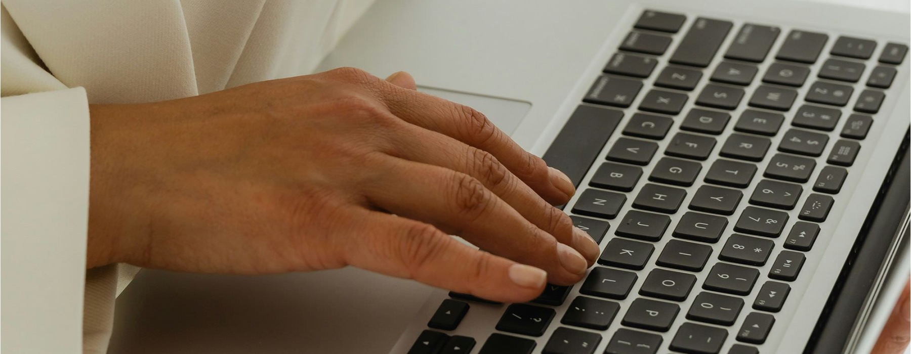 a person typing on a laptop